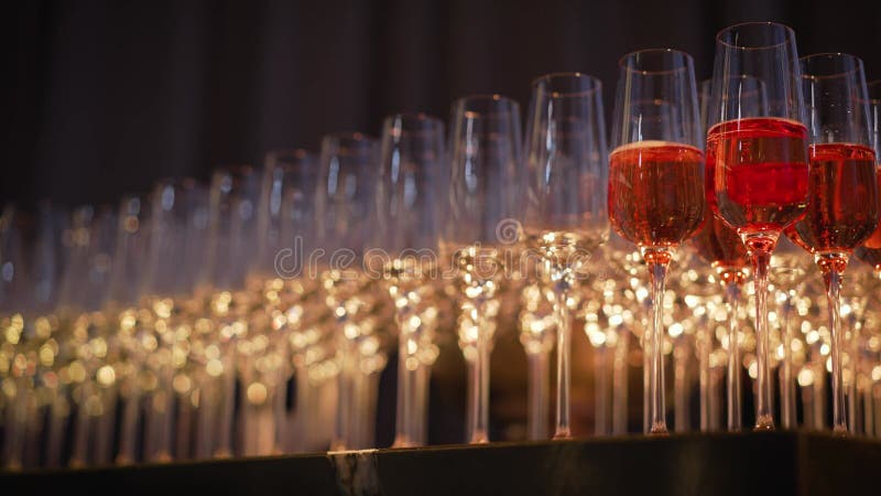 Champagne glasses are beautifully arranged at a wedding. Close up of several glasses beautifully arranged in a