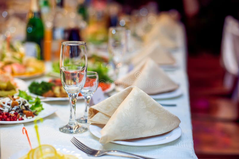 Catering service. Restaurant table with food. Huge amount of on the . Plates . Dinner time. National, nobody.