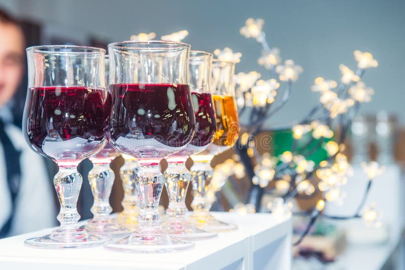 Catering table with alcoholic and non-alcoholic drinks on the business event in the hotel hall. Service at business meeting, party royalty free stock image