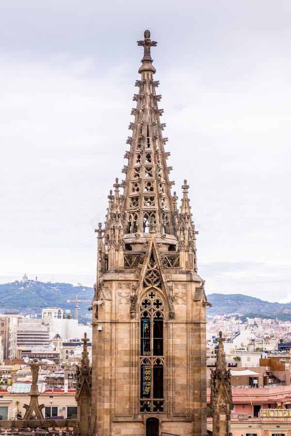 The Cathedral of Barcelona, detail of the main spire in typical gothic style with stone friezes and gargoyles. Barri Gotic