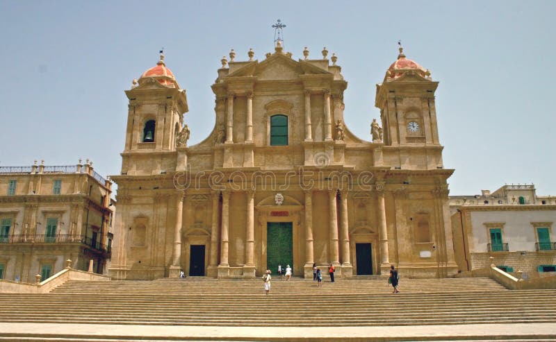 Front view of the cathedral of Noto, in Sicily, Unesco world heritage. The golden color is given from the lime stone. Front view of the cathedral of Noto, in Sicily, Unesco world heritage. The golden color is given from the lime stone.