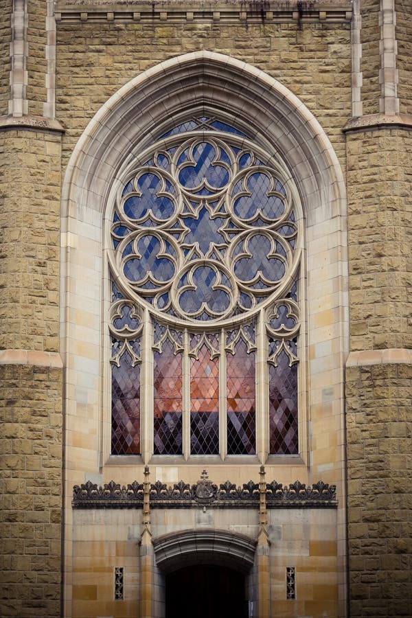 Archy shaped glass window above the entrance of the cathedral. Archy shaped glass window above the entrance of the cathedral