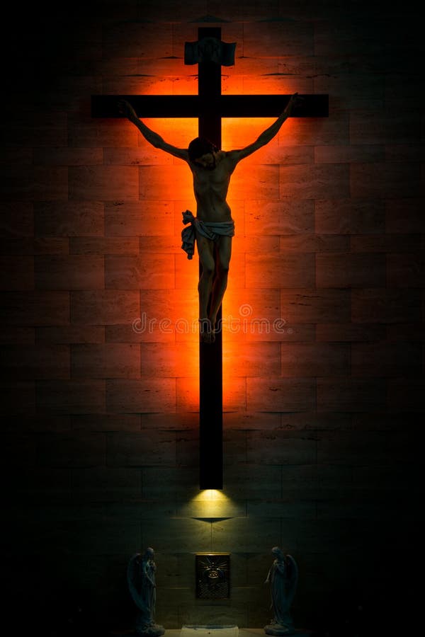 Catholic Christian Crucifix in silhouette, with tabernacle under