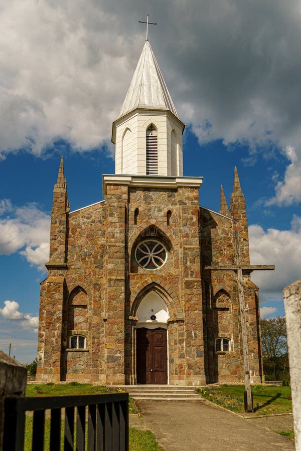 The Catholic church. The old red brick church. A historical building with a religious purpose stock photos