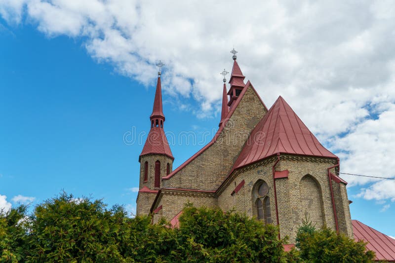 The Catholic church. The old red brick church. A historical building with a religious purpose royalty free stock image