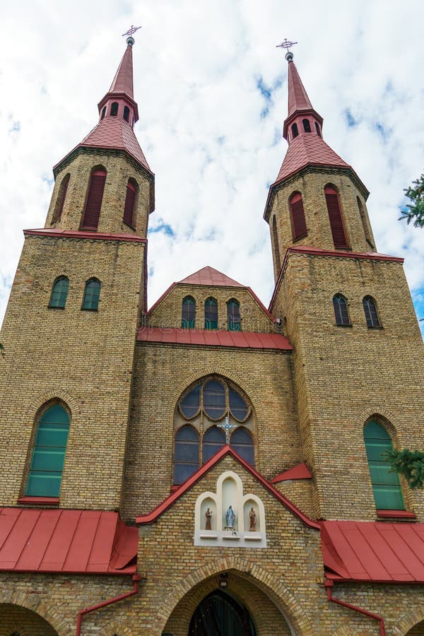 The Catholic church. The old red brick church. A historical building with a religious purpose royalty free stock photos