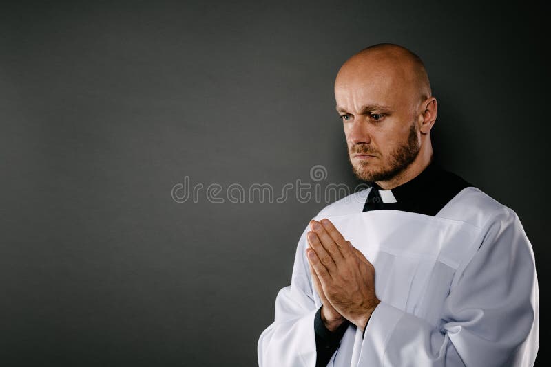 Catholic priest in white surplice prays royalty free stock images Catholic priest in white surplice prays royalty free stock images