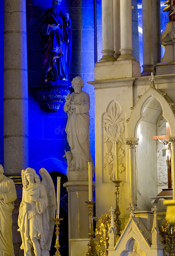 Crucifixion between Statues Under Stained Glass in the Duomo. Milan