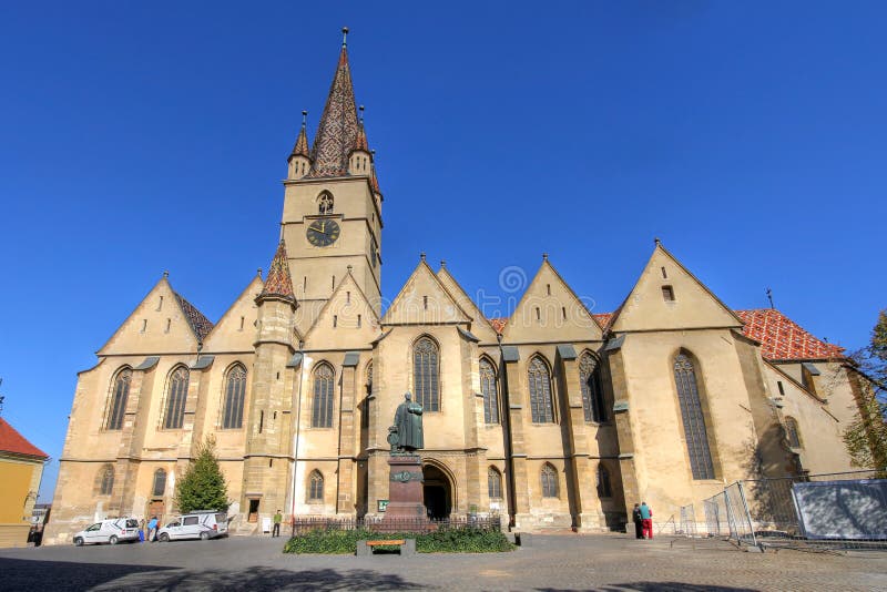 The Lutheran Cathedral of Saint Mary is the most impossing church in Sibiu, Romania, a masterpiece of Gothic Architecture. Daytime, wide angle composition. The Lutheran Cathedral of Saint Mary is the most impossing church in Sibiu, Romania, a masterpiece of Gothic Architecture. Daytime, wide angle composition.