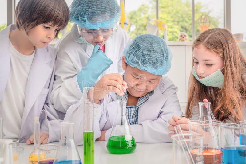 Students having chemistry experiments in science laboratory royalty free stock photo