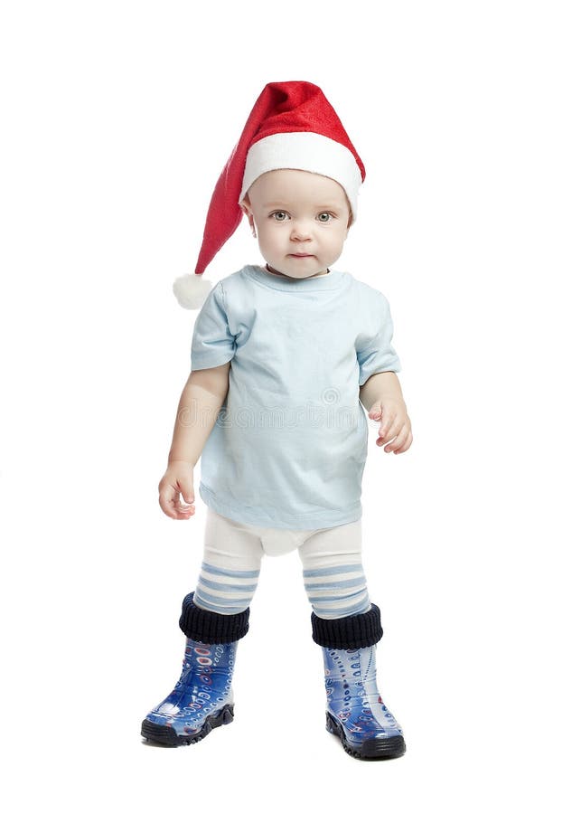 Caucasian baby boy in a red christmas cap