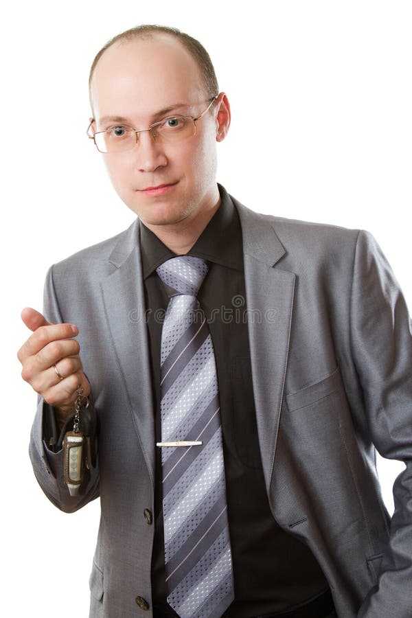 Caucasian boss with car keys on a white background