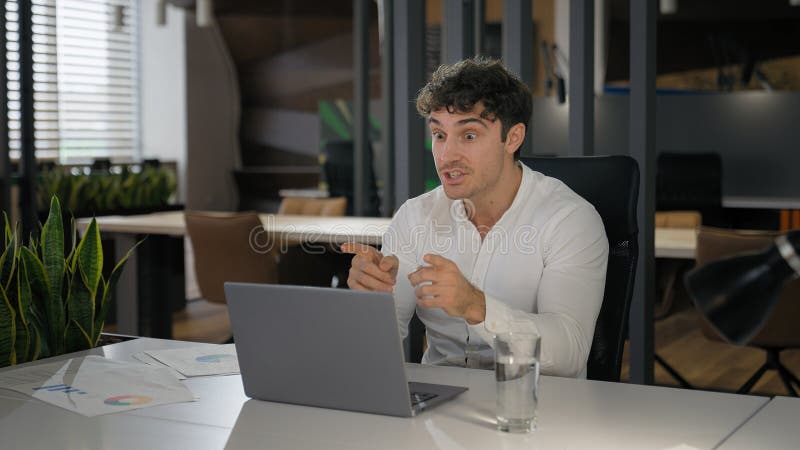 Caucasian businessman excited support negotiate idea talking business video call with laptop close computer happy win stock photography