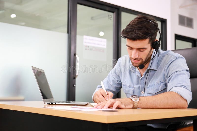 Caucasian businessman IT operator answering online phone call from customer as 24/7 customer service with copy space