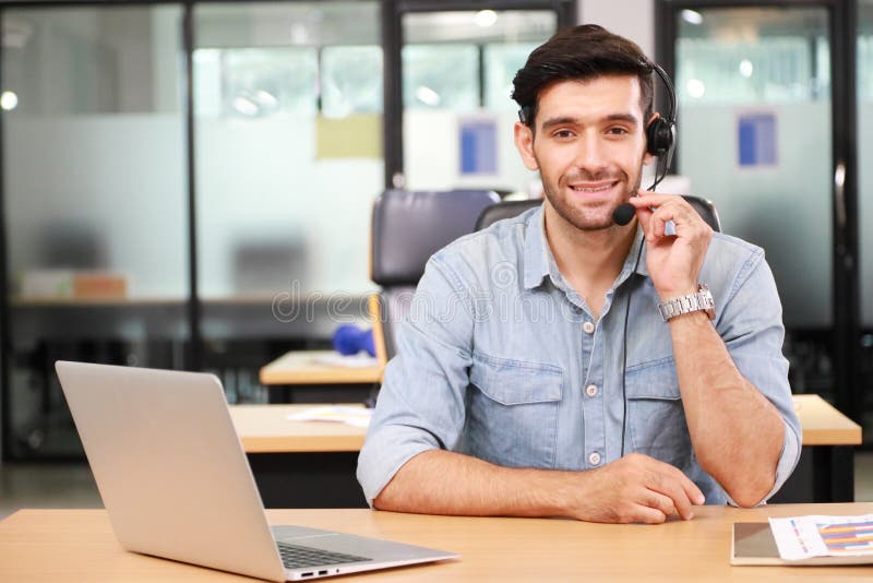 Caucasian businessman IT operator answering online phone call from customer as 24/7 customer service with copy space