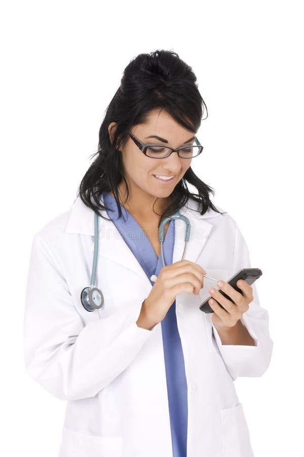 Caucasian woman doctor wearing a lab coat and entering data into a PDA