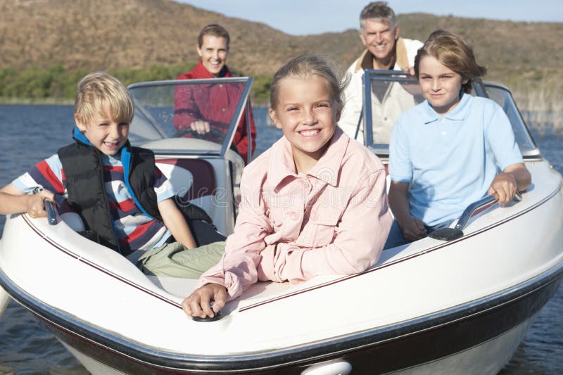 Caucasian Family Of Five In Speedboat