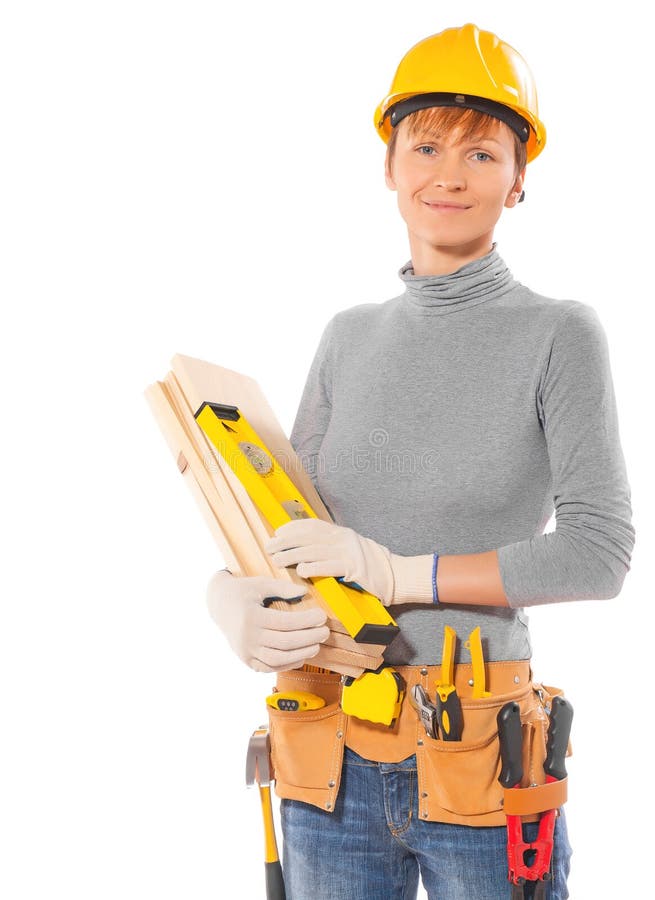 Caucasian female worker with construction tools holding wooden