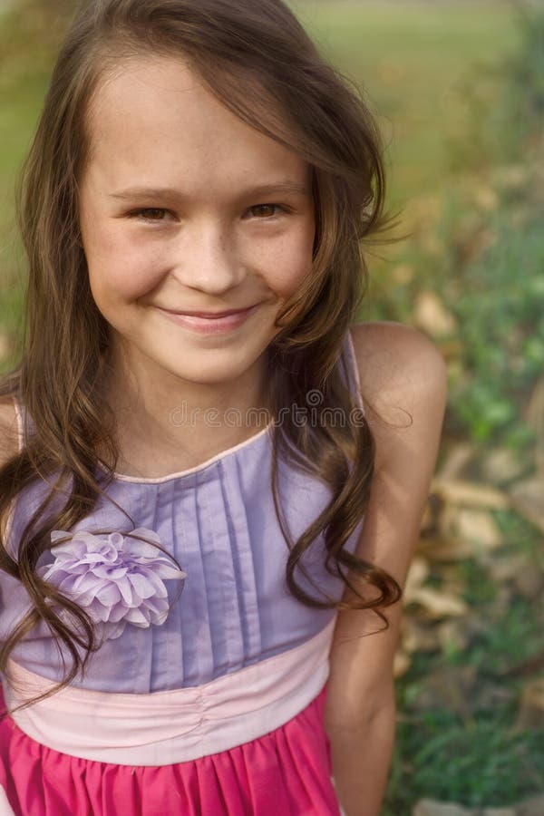 Caucasian Girl with Curly Hair Sitting on Grass Stock Image - Image of ...