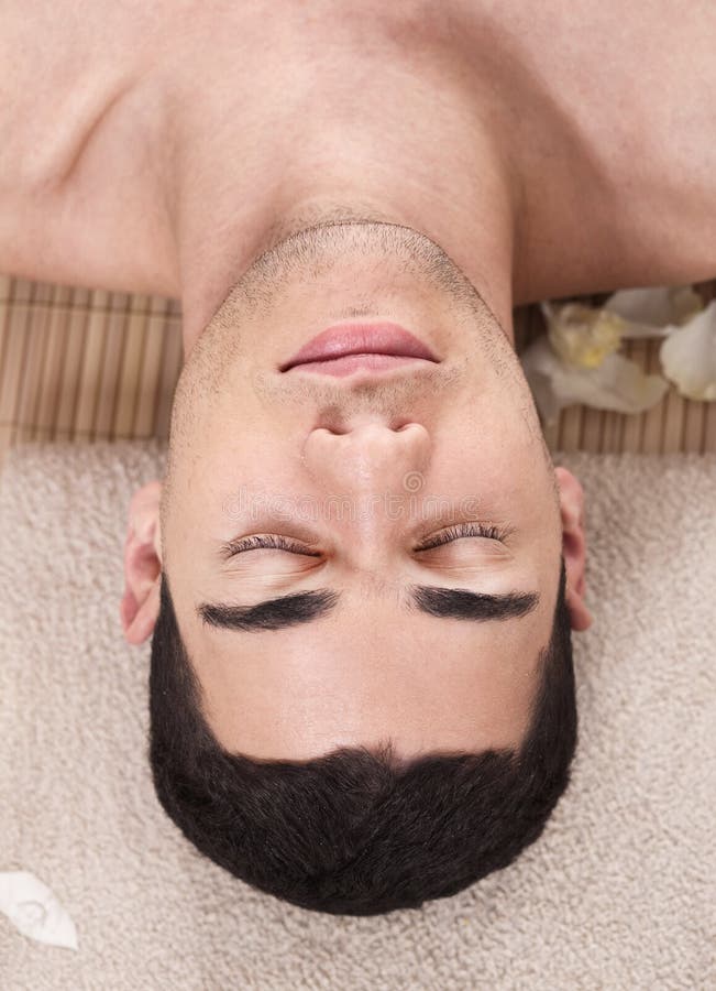 Caucasian handsome spa man ready to take massage royalty free stock photography