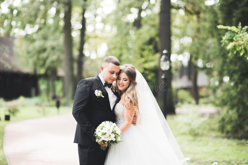 Caucasian happy romantic young couple celebrating their marriage. Outdoor