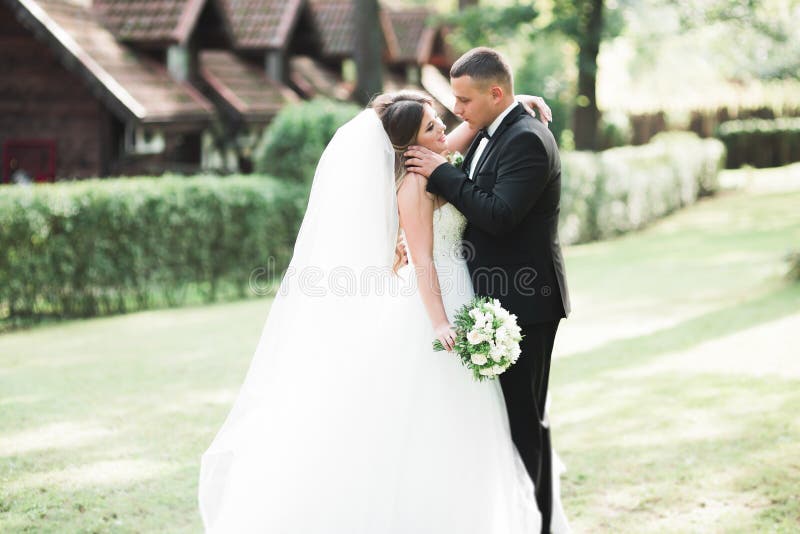 Caucasian happy romantic young couple celebrating their marriage. Outdoor