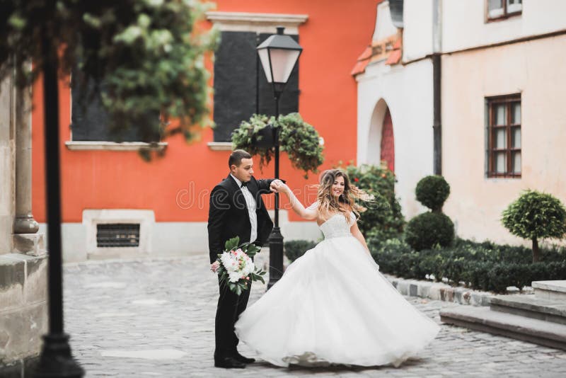 Caucasian happy romantic young couple celebrating their marriage. Outdoor