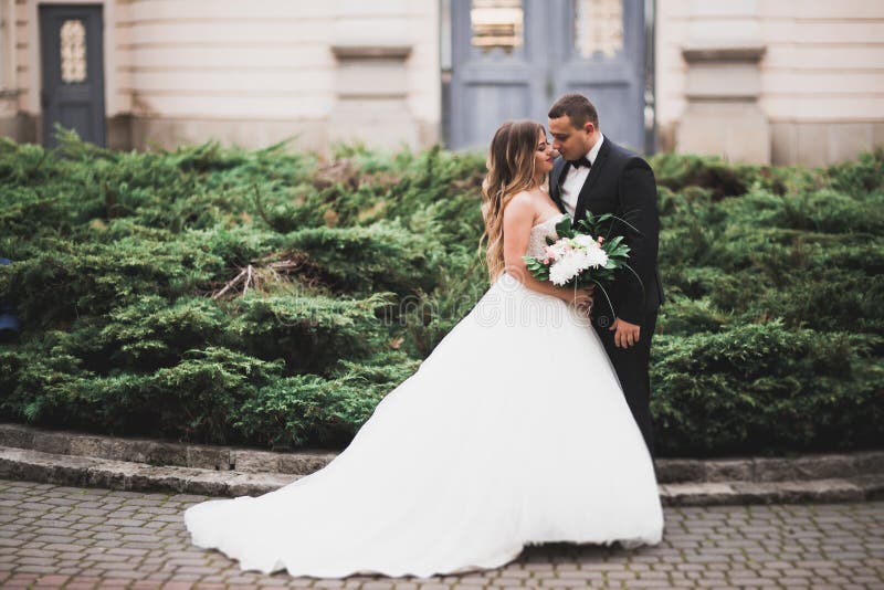 Caucasian happy romantic young couple celebrating their marriage. Outdoor