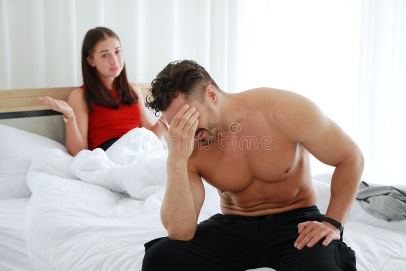 Caucasian Lover Couple on the Bed Unhappy in Having Sex and Have Problems in Relationship of Married Life image