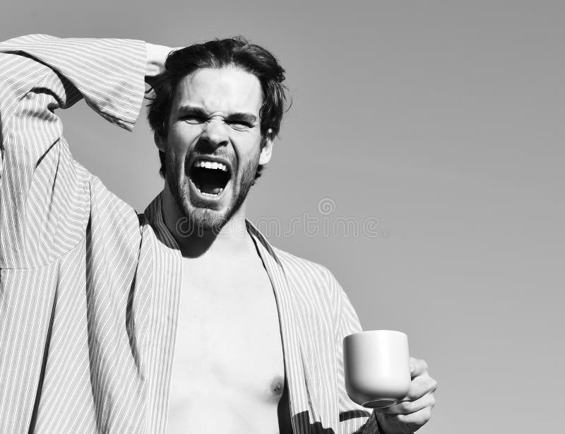 Caucasian Macho in Blue Striped Pajamas Holding Cup Stock Photo - Image ...