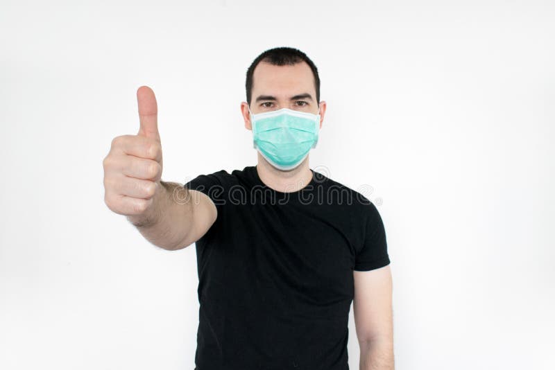 caucasian-male-man-young-standat-white-background-wear-mask-face-thumbs-up-gesture-one-hand-protect-yourself-safe-peopl-people-178303285.jpg