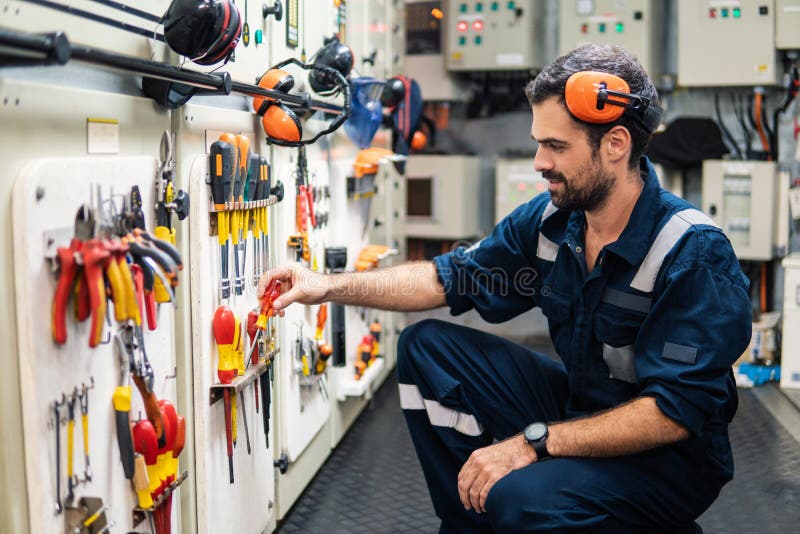 Marine Engineer Officer Working in Engine Room Stock Photo - Image