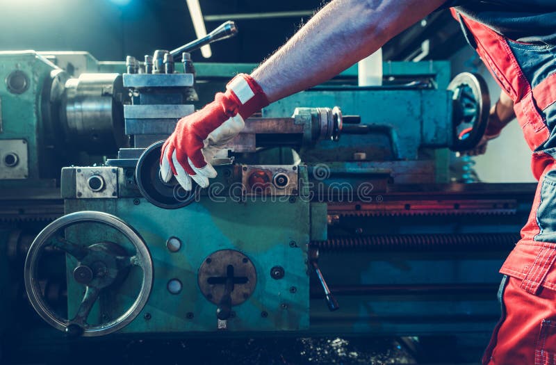 Caucasian Metalworking Technician Processing Material Using Lathe Stock caucasian-metalworking-technician-processing-material-using-lathe-stock