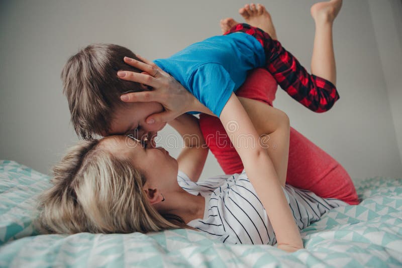 Caucasian mother and boy son playing in bedroom at home royalty free stock photo Caucasian mother and boy son playing in bedroom at home royalty free stock photo
