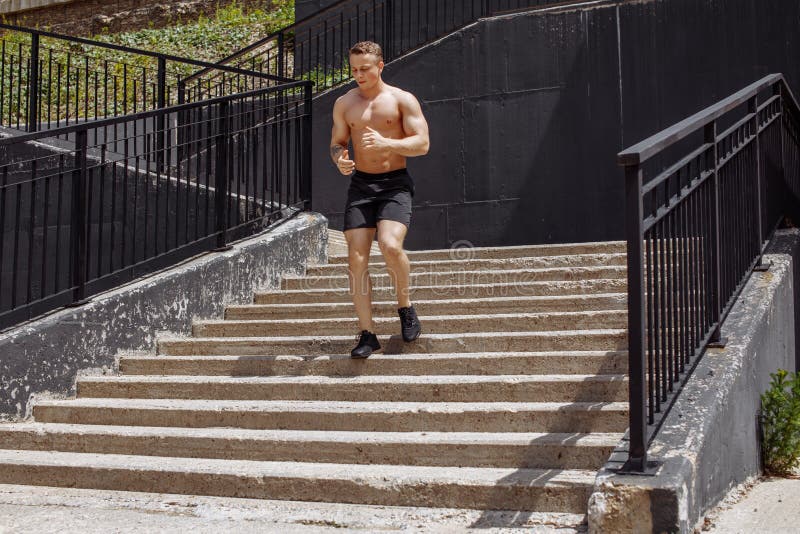 Athletic Sport Runner Man Running In Urban Training Stock Photo