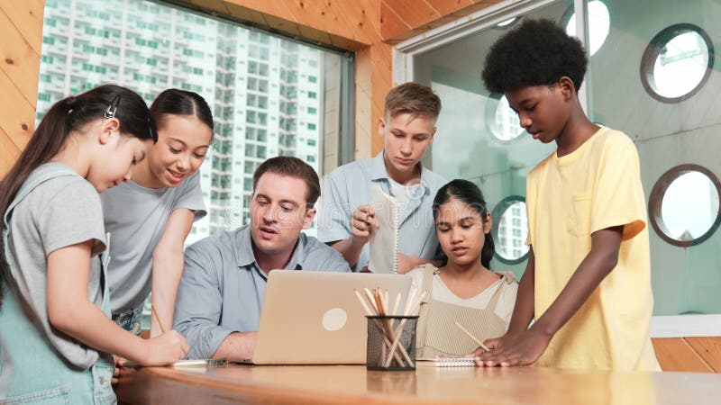 Caucasian teacher giving comment or advise student at classroom. Edification stock footage
