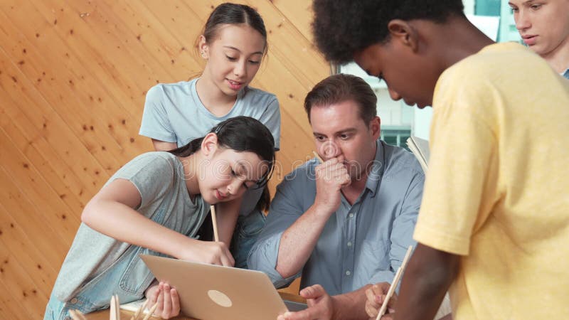 Caucasian teacher giving comment or advise student at classroom. Edification stock video footage