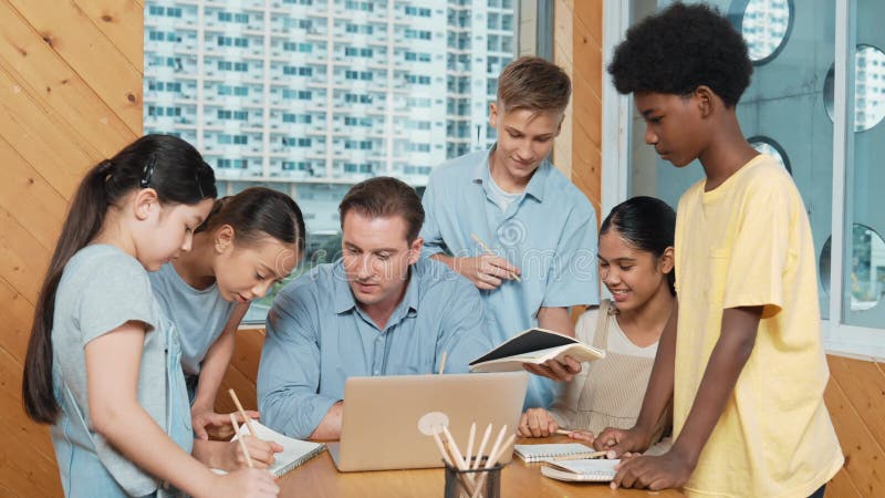 Caucasian teacher giving comment or advise student at classroom. Edification stock footage