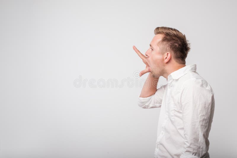 Caucasian man making bla bla sign with his hand. Empty promises. Disrespect to the interlocutor. Caucasian man making bla bla sign with his hand. Empty promises. Disrespect to the interlocutor.