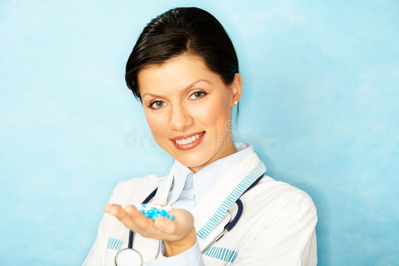 Caucasian woman as a doctor holding meds