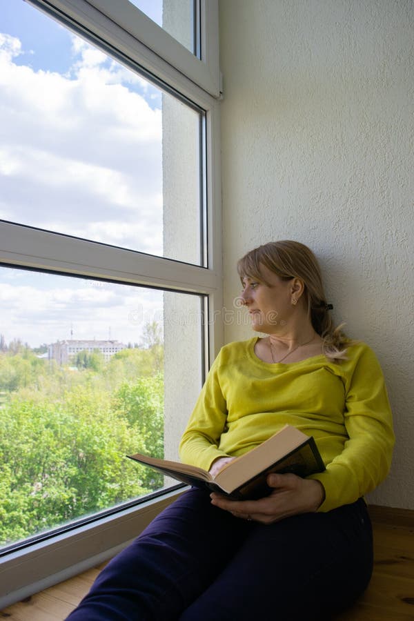 The Man Looks Outside Standing At The Open Window Of His Apartment Staying  At Home During The Epidemic And Quarantine Stock Photo - Download Image Now  - iStock