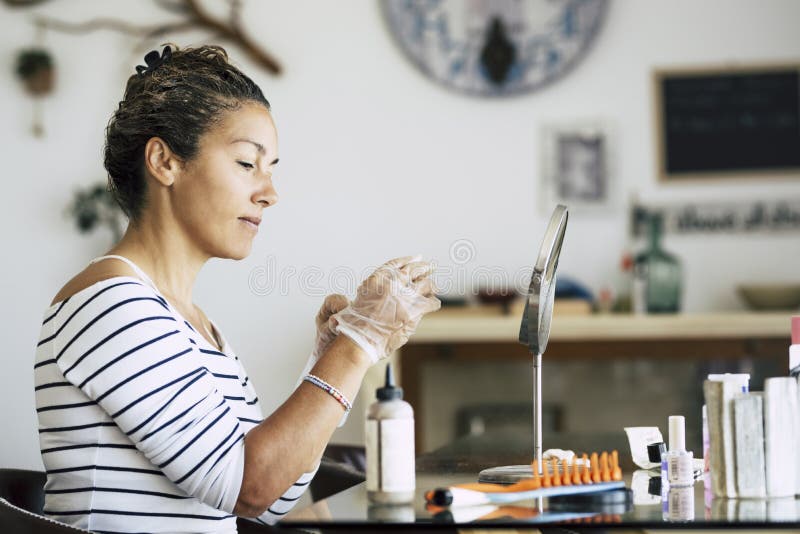Caucasian woman enjoying self made beauty farm and hair style concept at home - hair dye activity during lockdown quarantine with stock photography Caucasian woman enjoying self made beauty farm and hair style concept at home - hair dye activity during lockdown quarantine with stock photography
