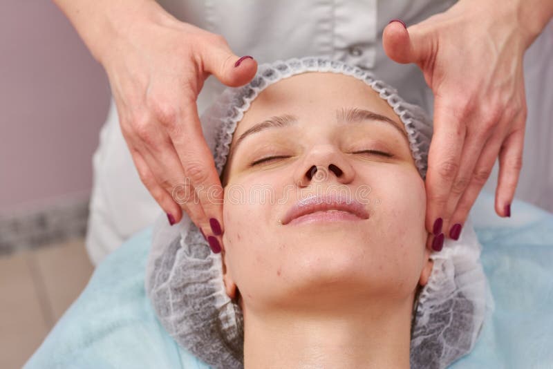 Caucasian woman, facial massage.
