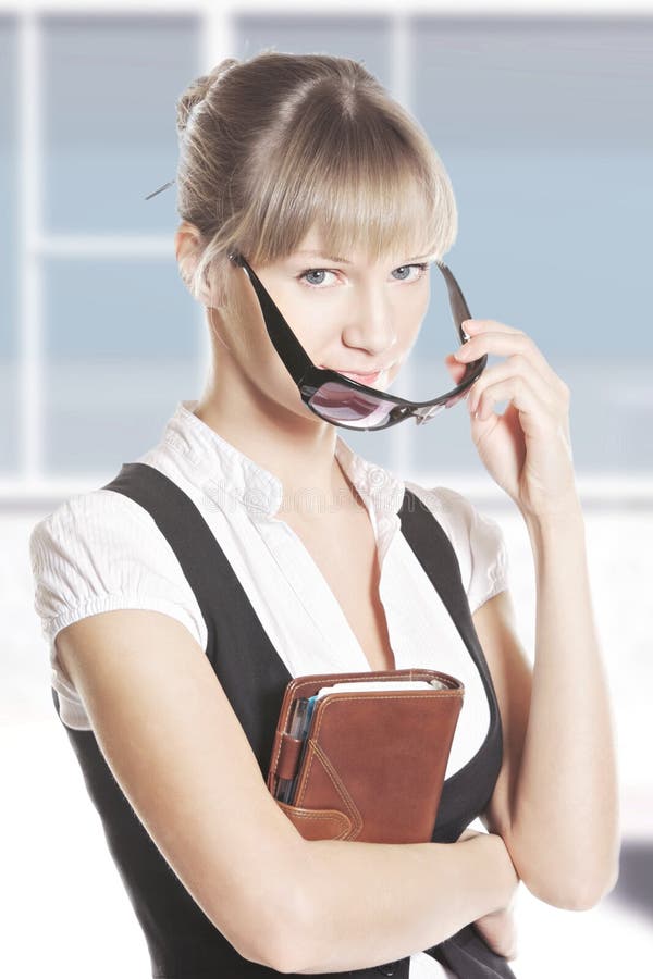 Caucasian woman with leather notebook at office royalty free stock photos