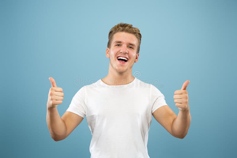 Caucasian Young Man`s Half-length Portrait on Blue Background Stock ...