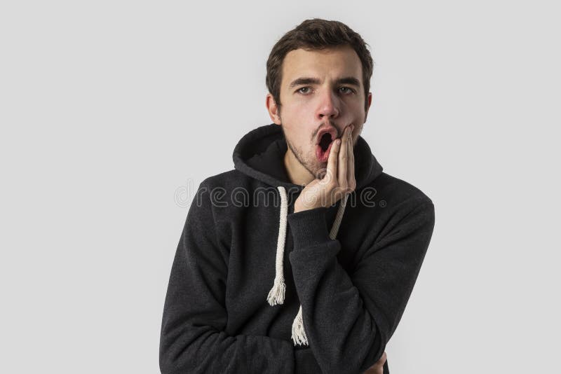 Caucasian young man suffering from toothache. Isolated on white background. Toothache concept royalty free stock photography Caucasian young man suffering from toothache. Isolated on white background. Toothache concept royalty free stock photography