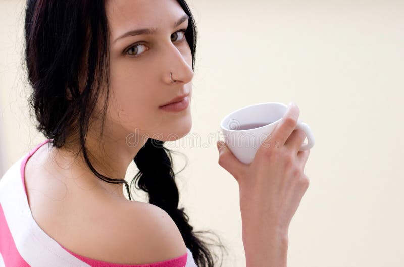 Caucasian young woman with cup of tea