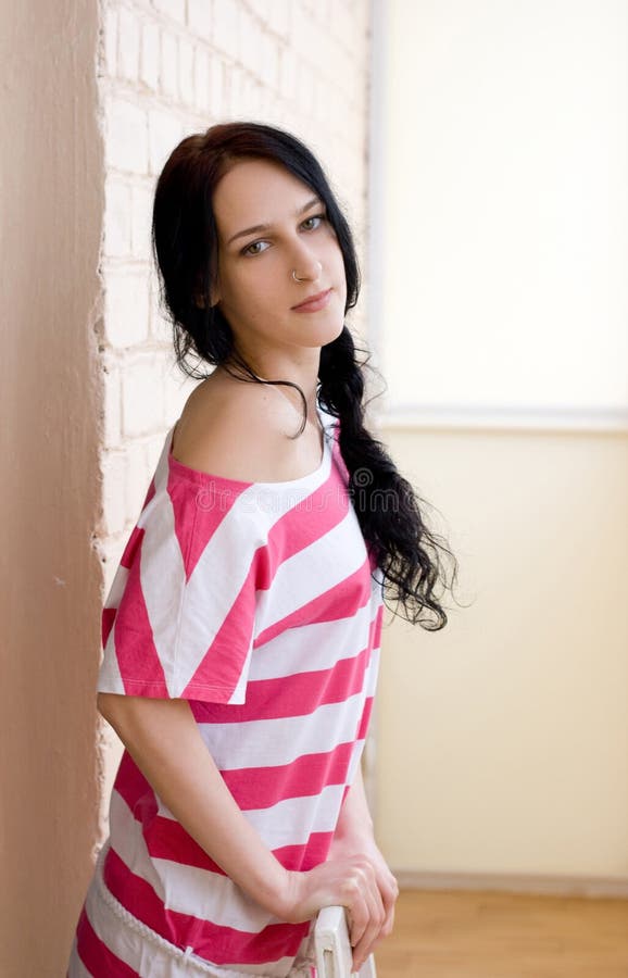 Caucasian young woman in light room