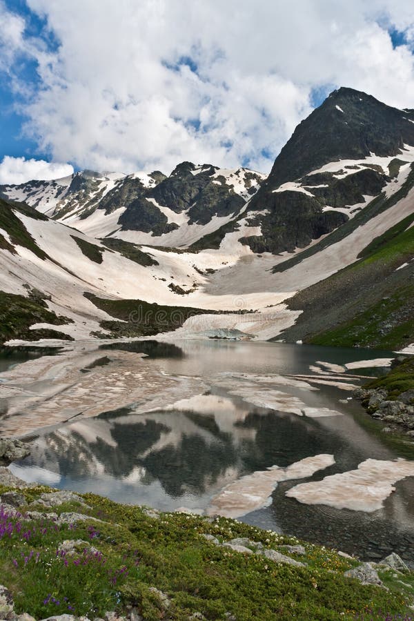 Caucasus landscape with crystal river.