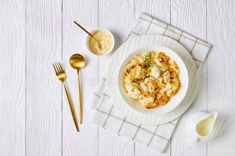 Cauliflower cheese with garlic and thyme, flat lay stock photos